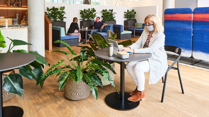 woman-socially-distanced-in-work-cafe