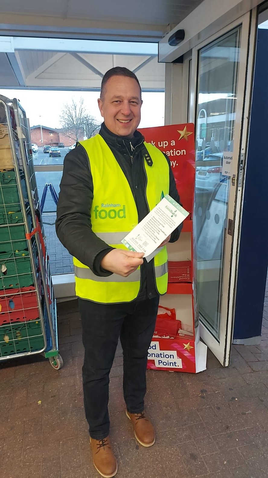 Richard Tant, HR Manager from IE handing out leaflets at the local Tesco