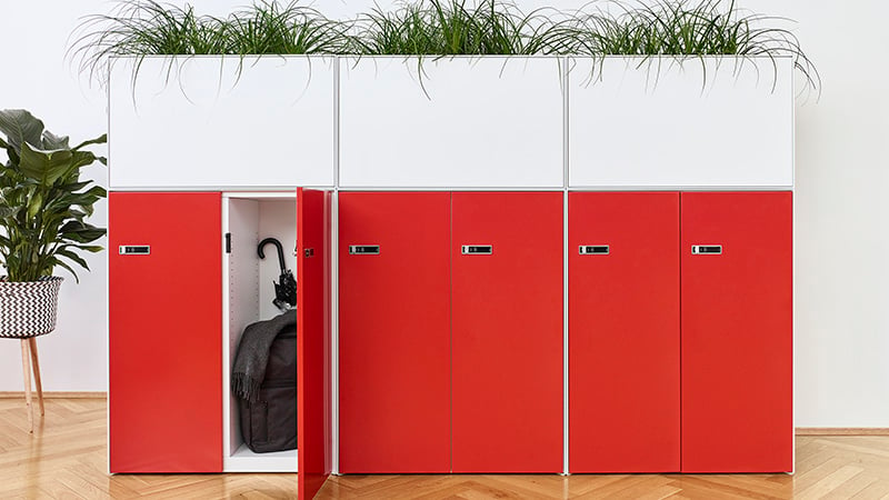 red office lockers with plants